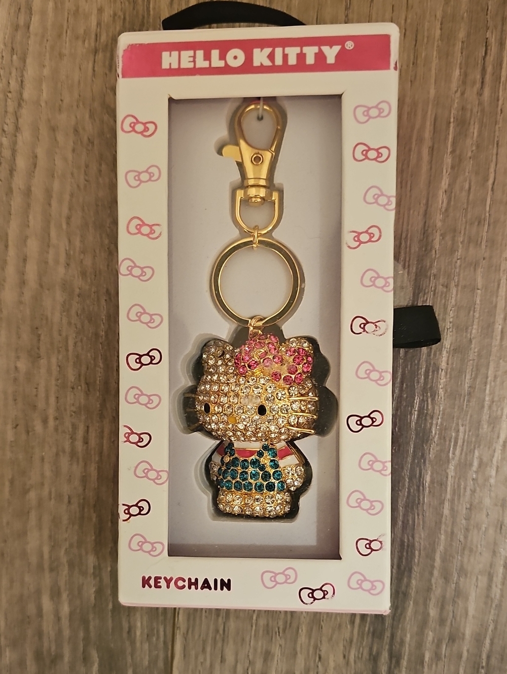 Hello Kitty Gold-tone Crystal Key & Charm with Pink Bow and Multicolor Outfit